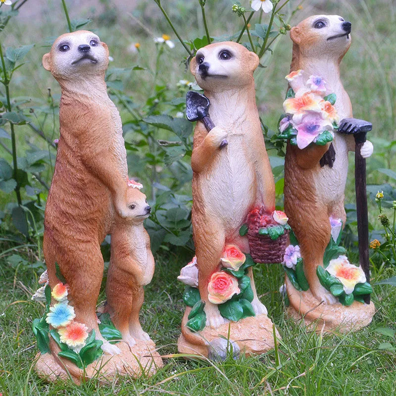 Three straw hat mongoose resin ornaments for garden decoration: mother and son, with rake, and with shovel.