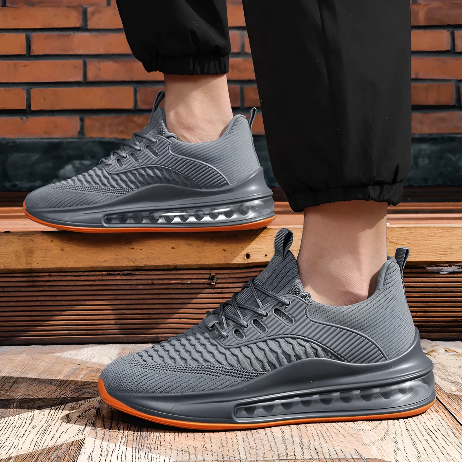 Men's black low-top mesh running shoe with lace-up front and rubber sole.