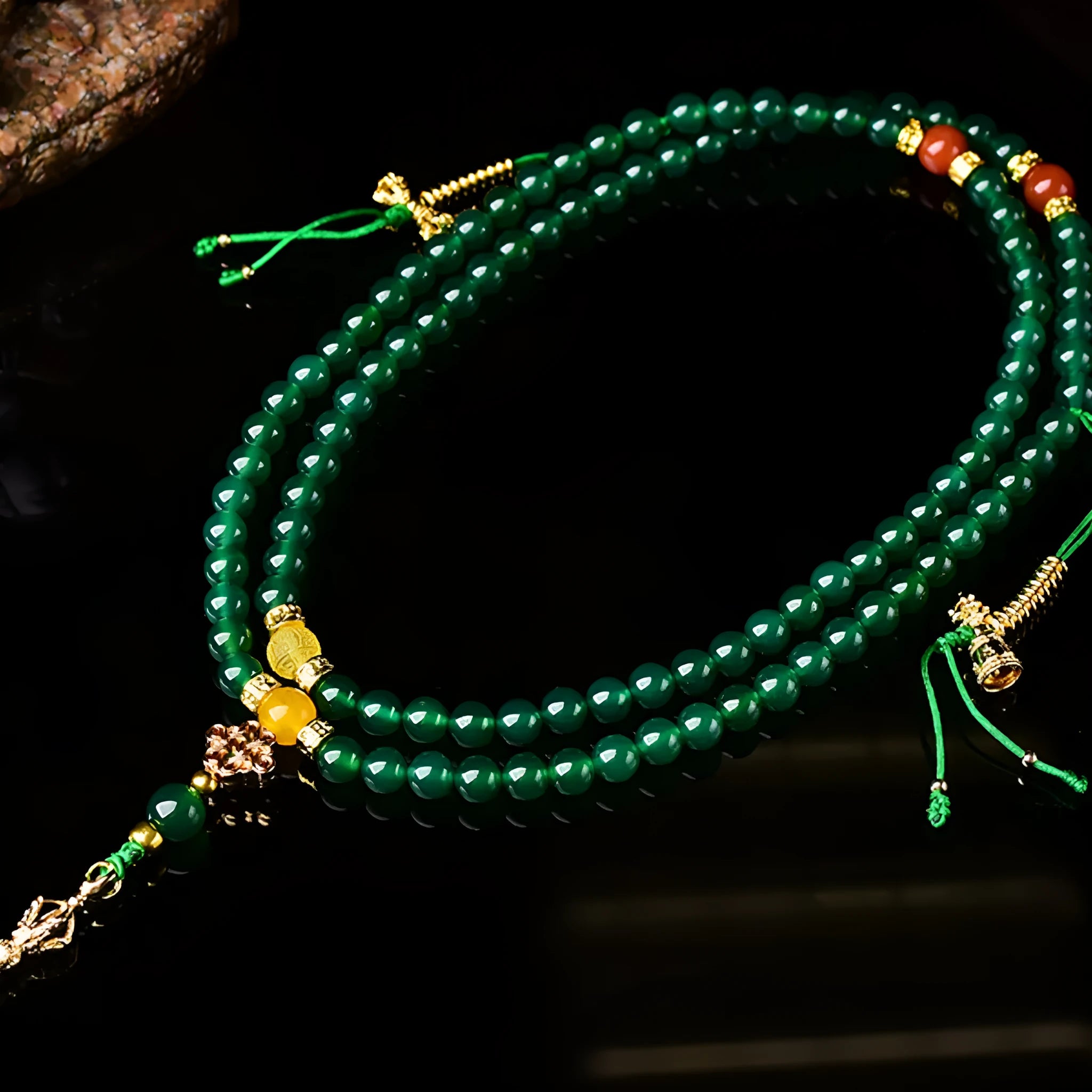Handmade multi-strand green agate bracelet from Brazil on a wrist, showing stone sizes 6mm, 8mm, and 10mm.