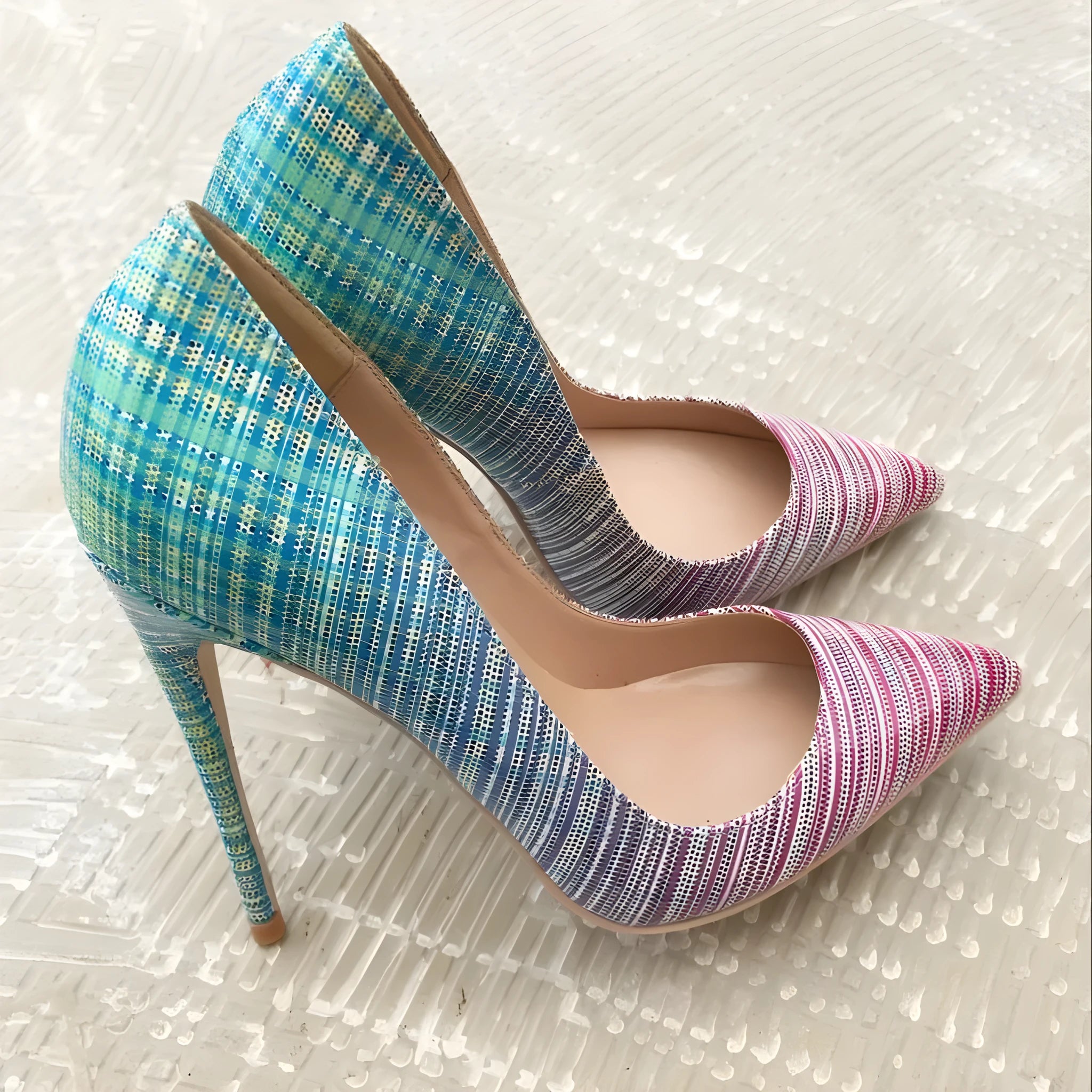 Pink and blue gradient patent leather women's high heels with a pointed toe and high heel.