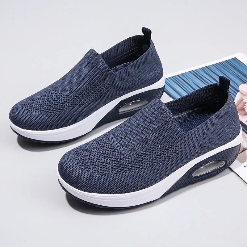 Women's mesh running shoes with air cushion in multiple colours showing round toe and mid-heel design
