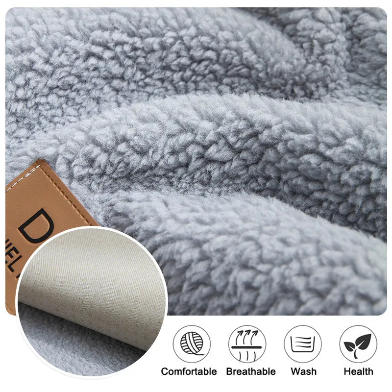 Beige plush lamb wool sofa cover with anti-slip backing laid flat on a modern grey sofa.