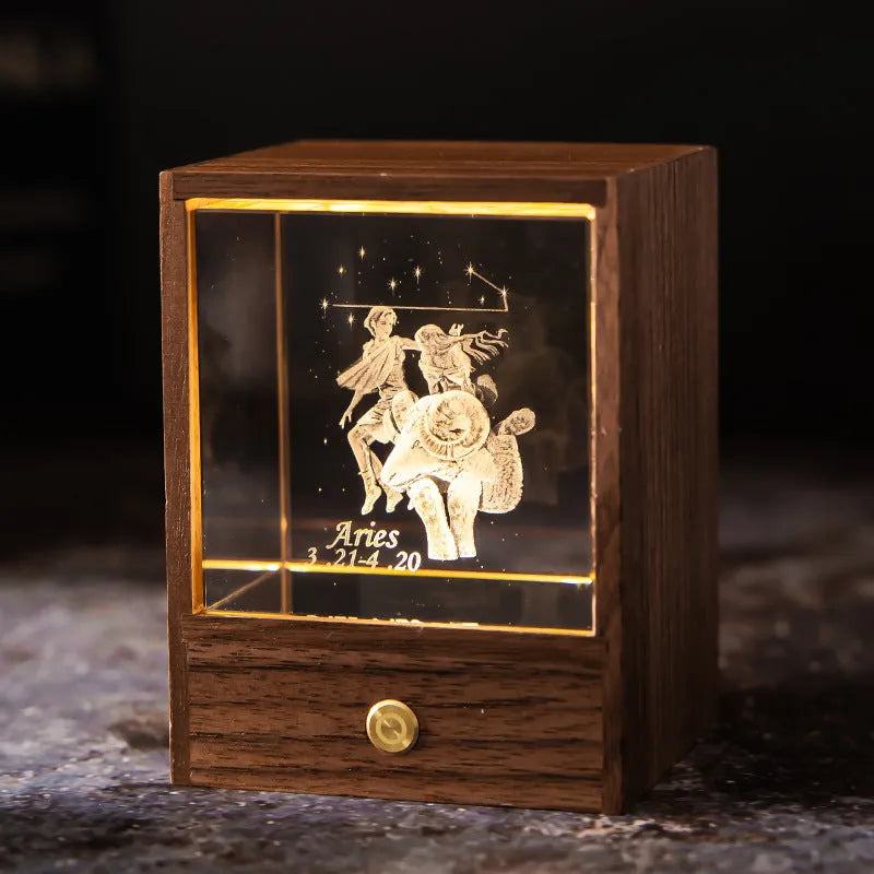 Crystal LED table lamp with black walnut base and K9 crystal showing constellation night light effect