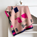 Long beige imitation cashmere style polyester scarf draped to show its 185 cm length and texture.