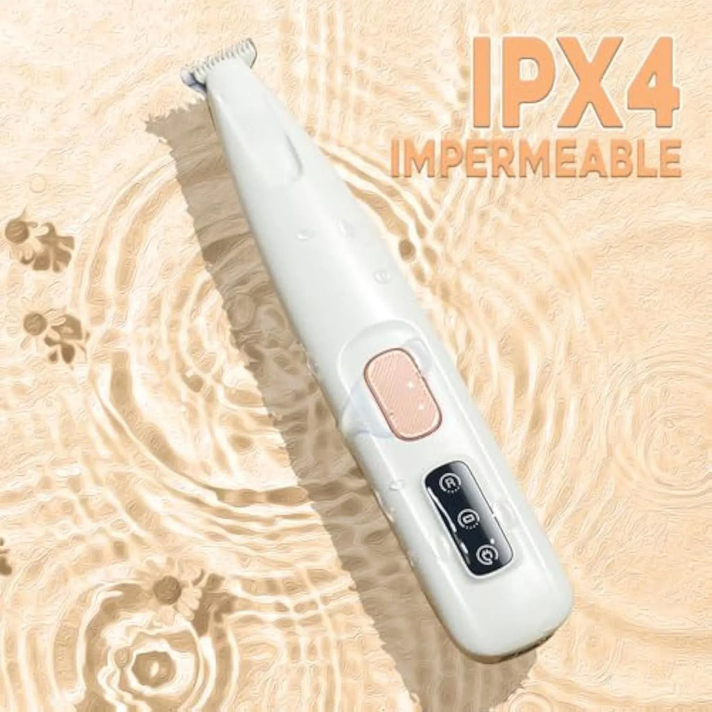 White rechargeable electric dog paw trimmer with LED light and four comb attachments on a table