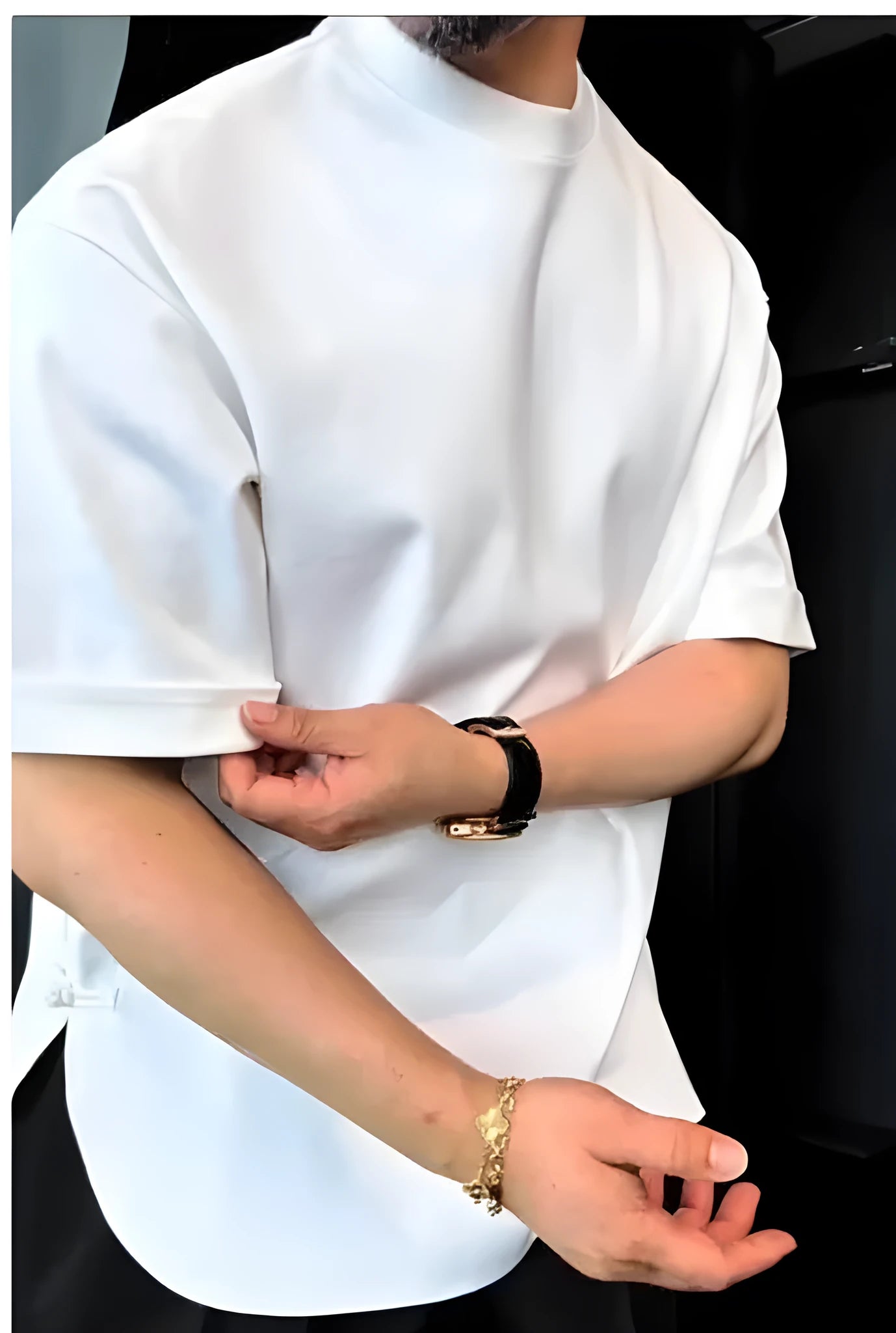 White men's buttoned cotton t-shirt with a dropped shoulder design and curved round hem.