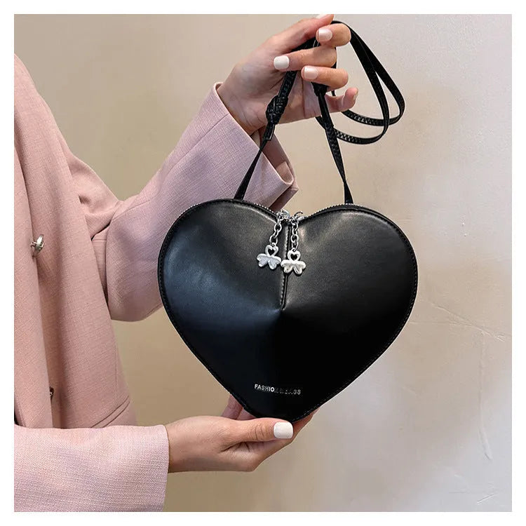 Women's PU leather heart shape crossbody bag in milky white with sewing line design and single shoulder strap