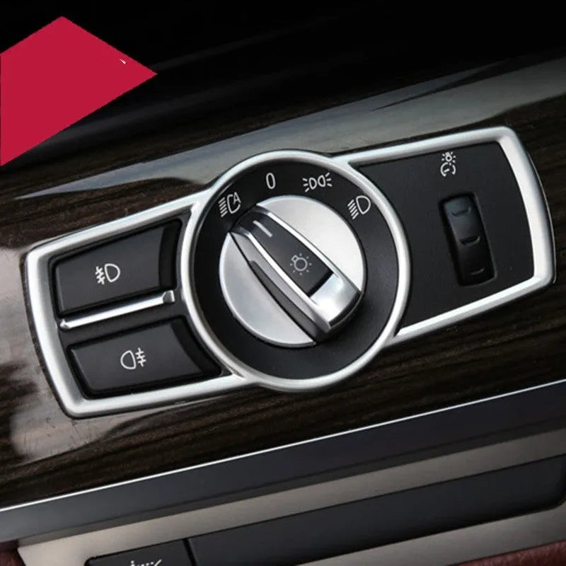 Silver ABS plastic interior sticker for BMW headlight switch frame on 5 Series, 7 Series, X3, and X4 models