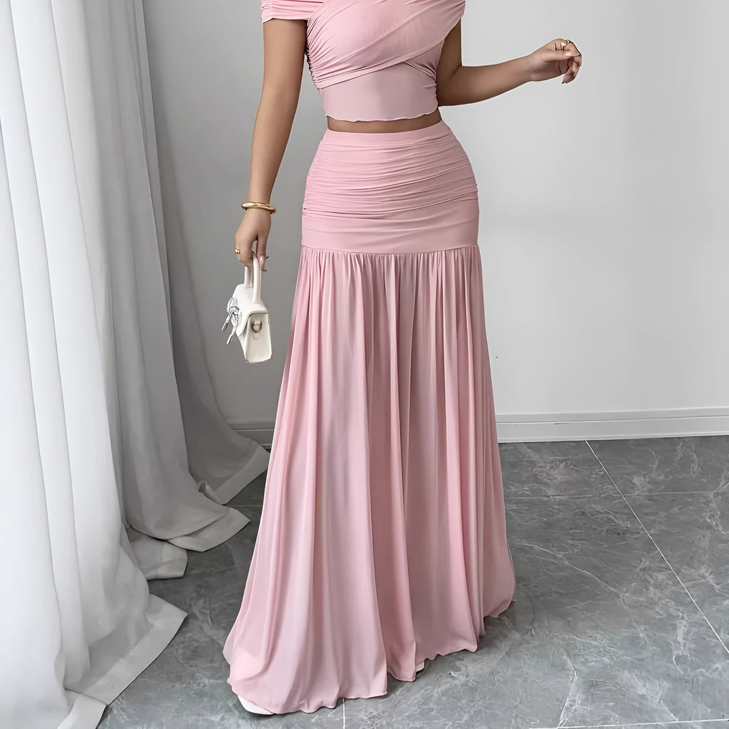Women's pleated long skirt in polyester fibre, pink colour, with medium stretch and irregular hem, side view