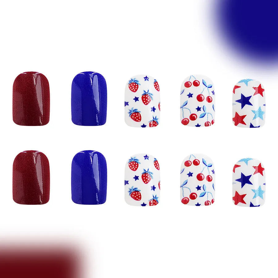 Short glossy red and blue strawberry cherry false nail stickers Independence Day themed 24 piece set.