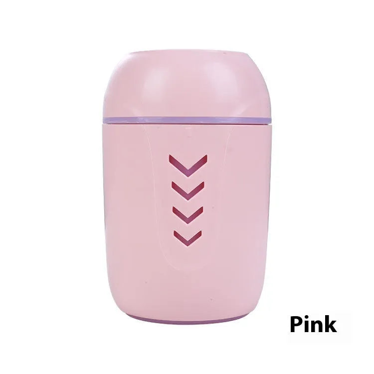 Round white portable USB air purifier for car and desktop use on a wooden surface.