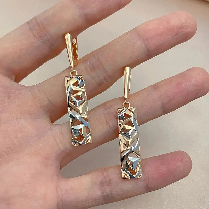 Rectangular two-tone hollow stud earrings with geometric design and electroplated finish