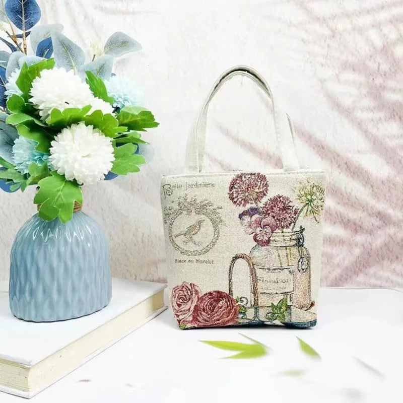 Double-sided gold wire embroidered handheld canvas tote bag in a choice of seven patterns and three sizes.