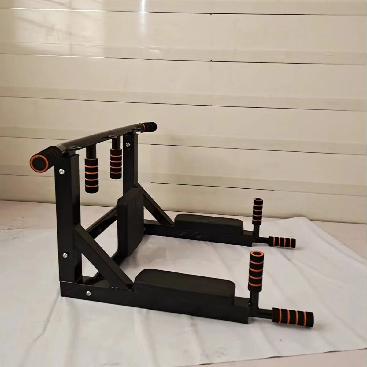 Black metal wall-mounted fitness rack for sandbag and single parallel bars pull-up training.