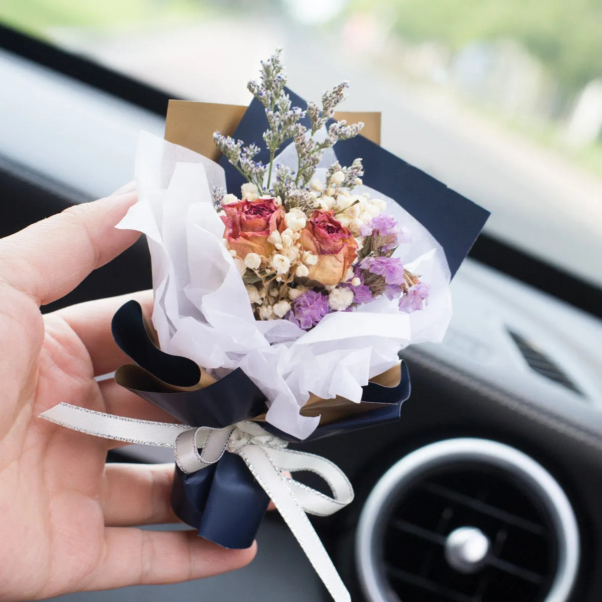 Car vent clip aromatherapy diffuser with dried flower bouquet in multiple colour options.