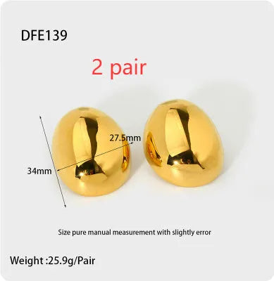 A pair of geometric stainless steel ear studs with an 18K gold plated, glazed surface and line detailing.