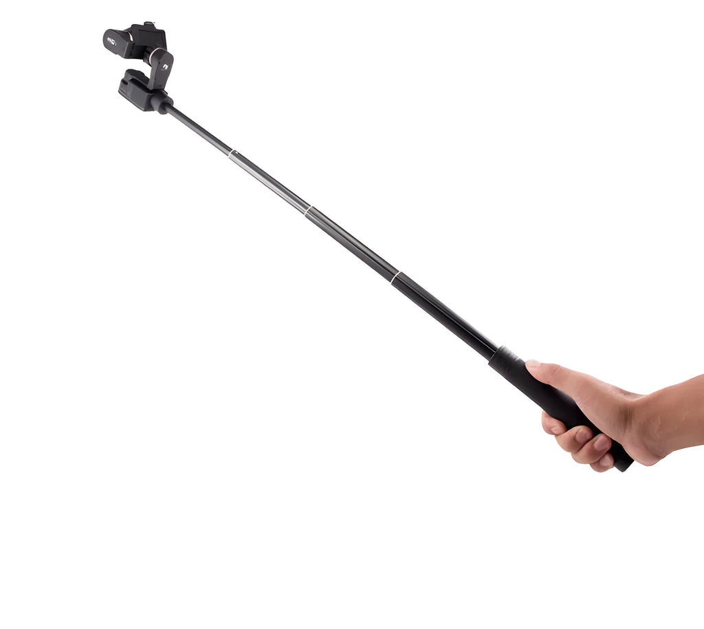Black retractable selfie stick extended with smartphone attached in adjustable clamp