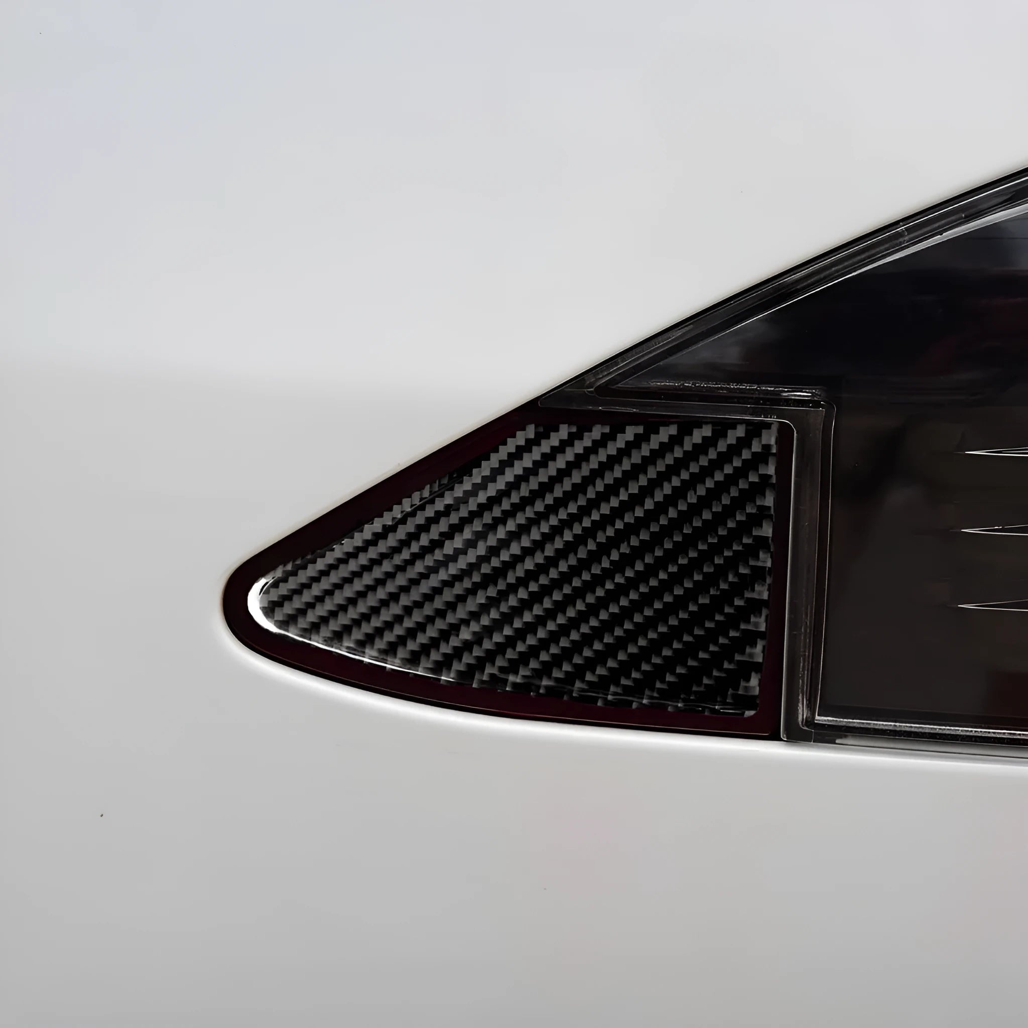Black carbon fibre USB charging port panel decorative sticker with 3M adhesive backing.