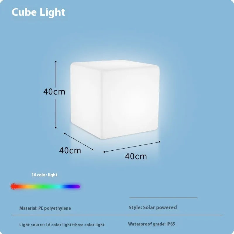 Square LED cube stool light in garden setting showing modern design with lighting