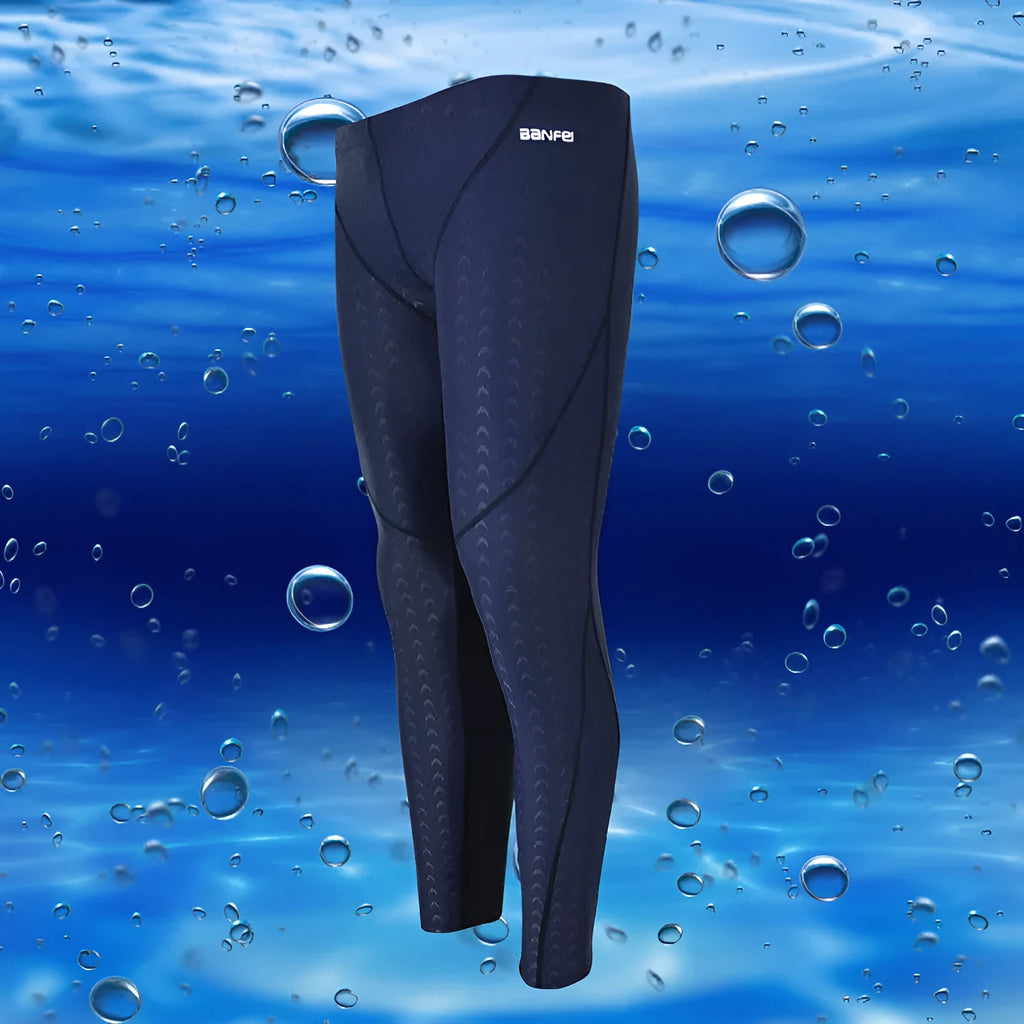 Men's black and green line nylon cropped swimming trunks on a white background.