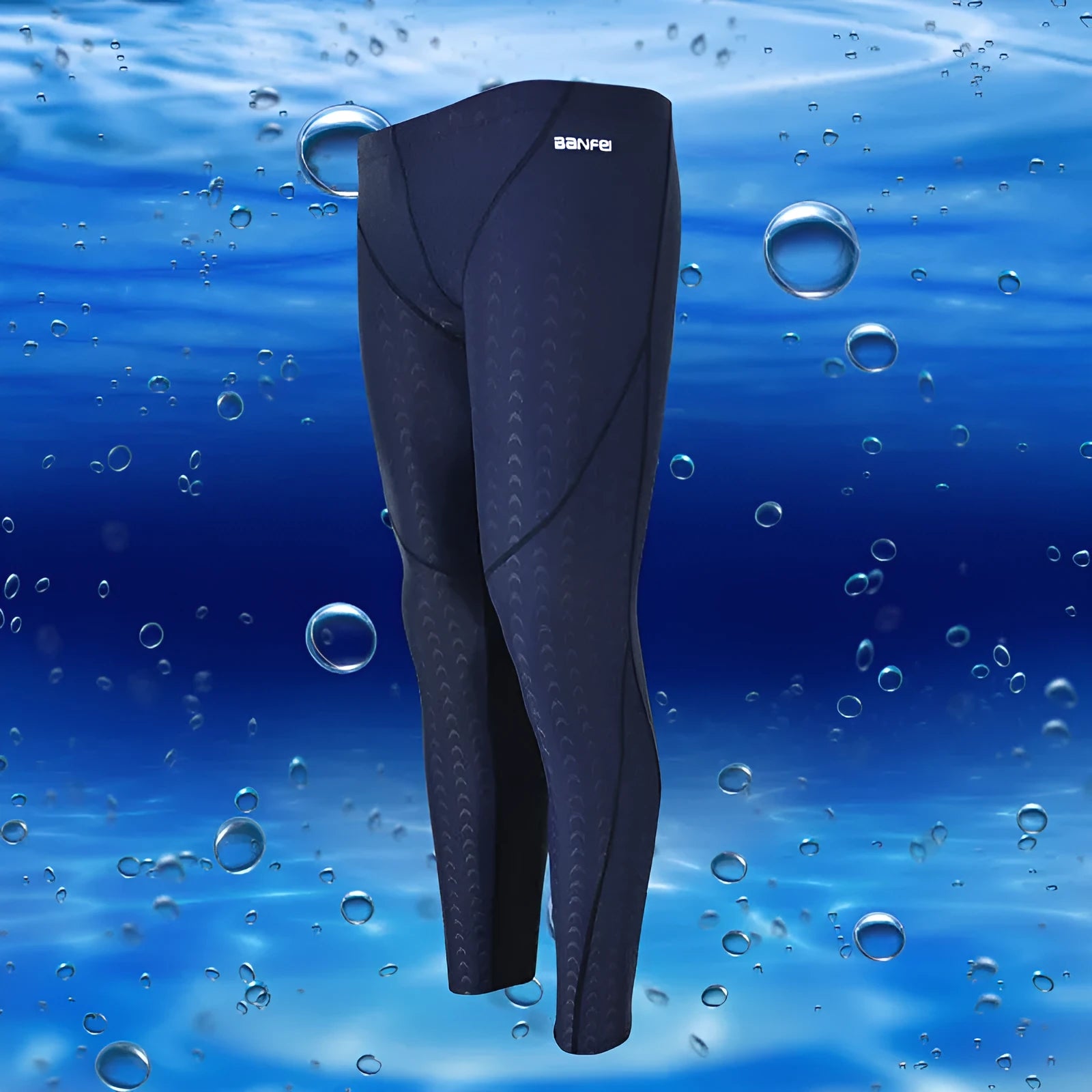 Men's black and green line nylon cropped swimming trunks on a white background.