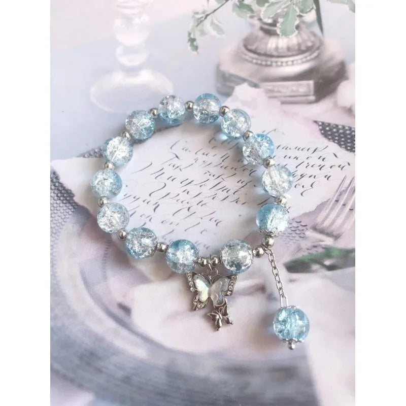 Chinese style glass bead bracelet with bamboo leaf design and manual craftsmanship details.