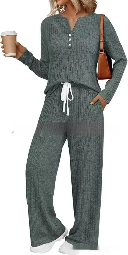 Knitted V-neck striped long coat with long sleeves, pockets, and a lace-up detail on a hanger.