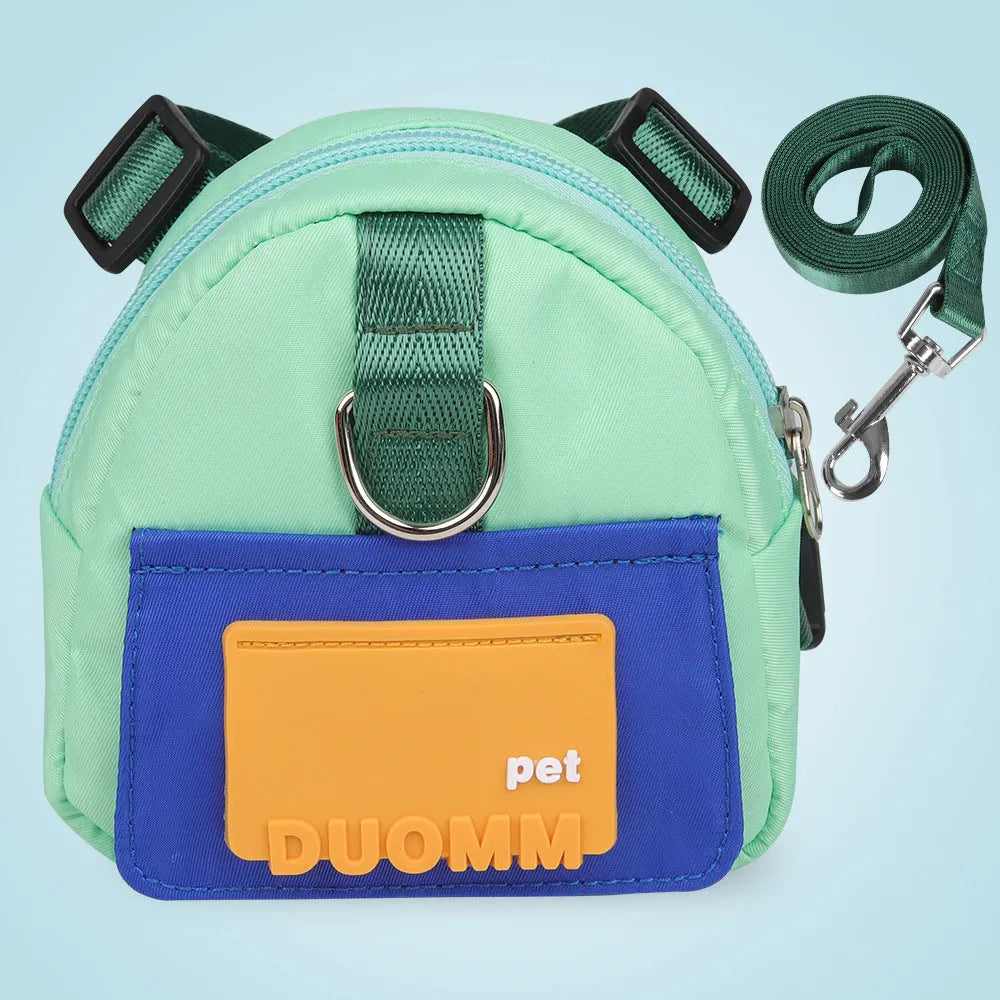 Adjustable dog backpack with storage compartments in blue colour showing harness straps and mesh panels