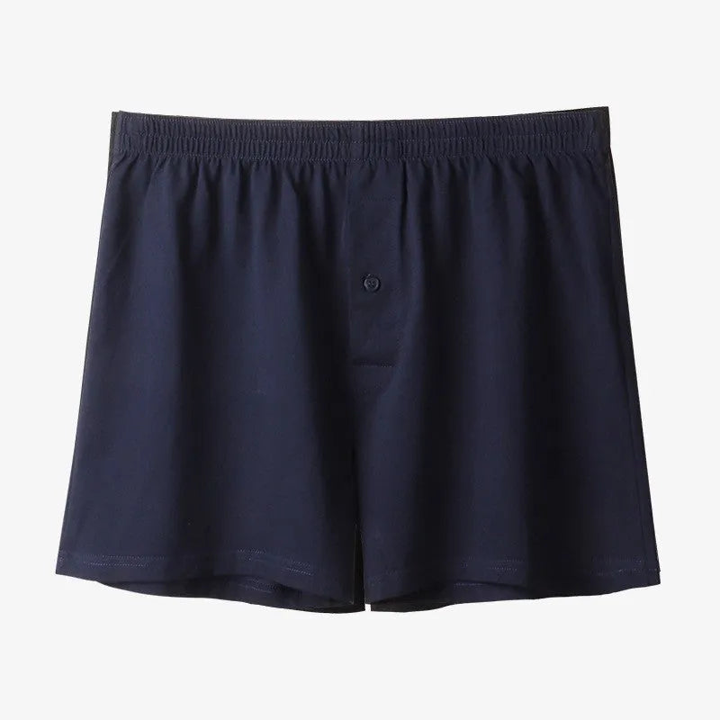 Men's high-waist cotton boxer shorts in black, grey, and navy blue on a size chart
