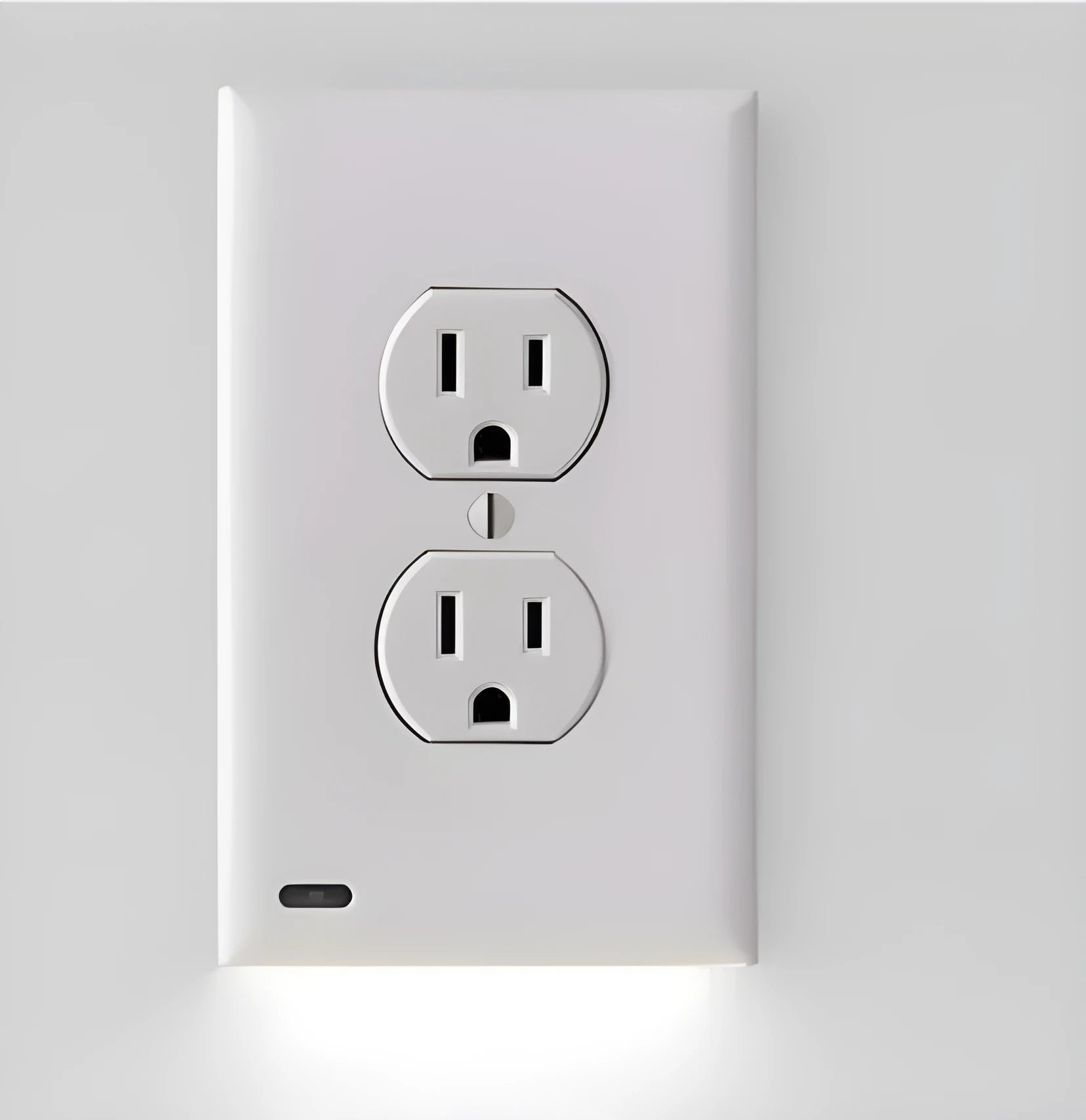 White LED socket induction night light installed in electrical outlet with automatic sensor