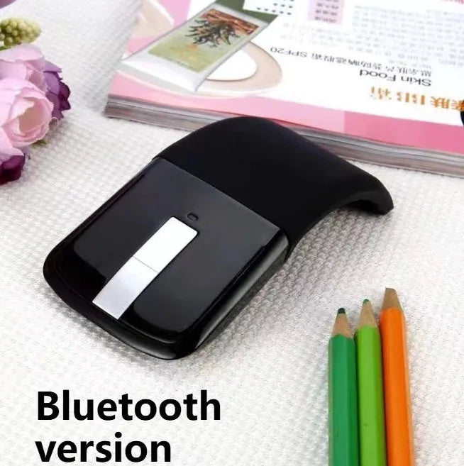Folded Bluetooth wireless mouse showing compact 131.2mm length with touch-sensitive surface