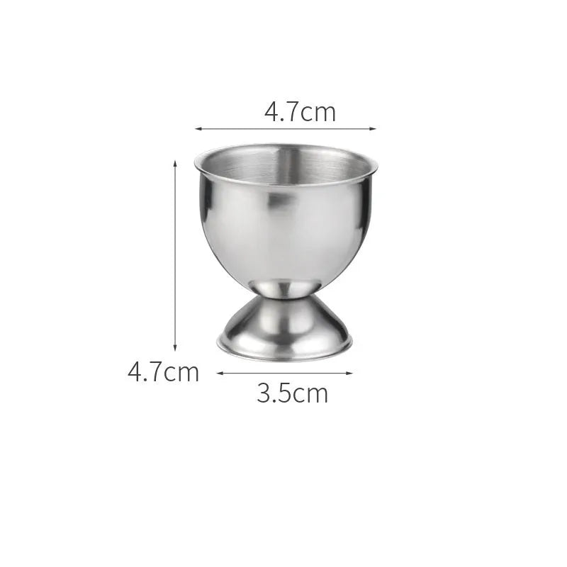 Creative stainless steel egg bracket in silver finish, holding eggs on a kitchen countertop.