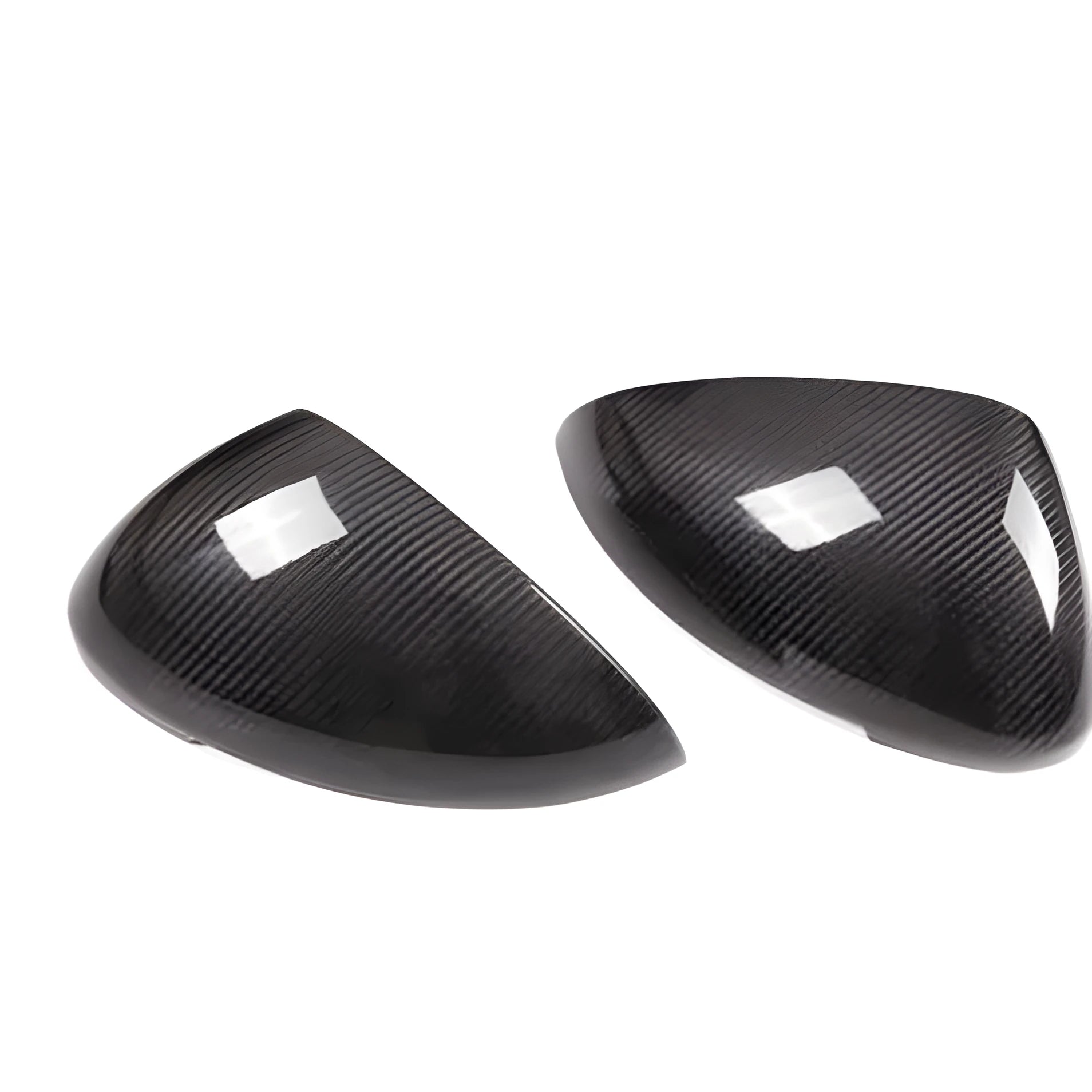 Pair of black true carbon fibre rearview mirror covers for Porsche Macan, showing textured weave pattern.