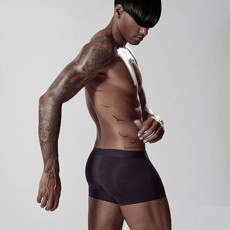 Seamless men's modal underwear in green colour showing mid-waist design and solid colour construction