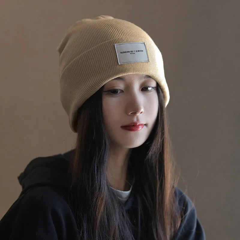Women's knitted hat in dome crown style, polyester, available in pink, khaki, black, and beige for winter