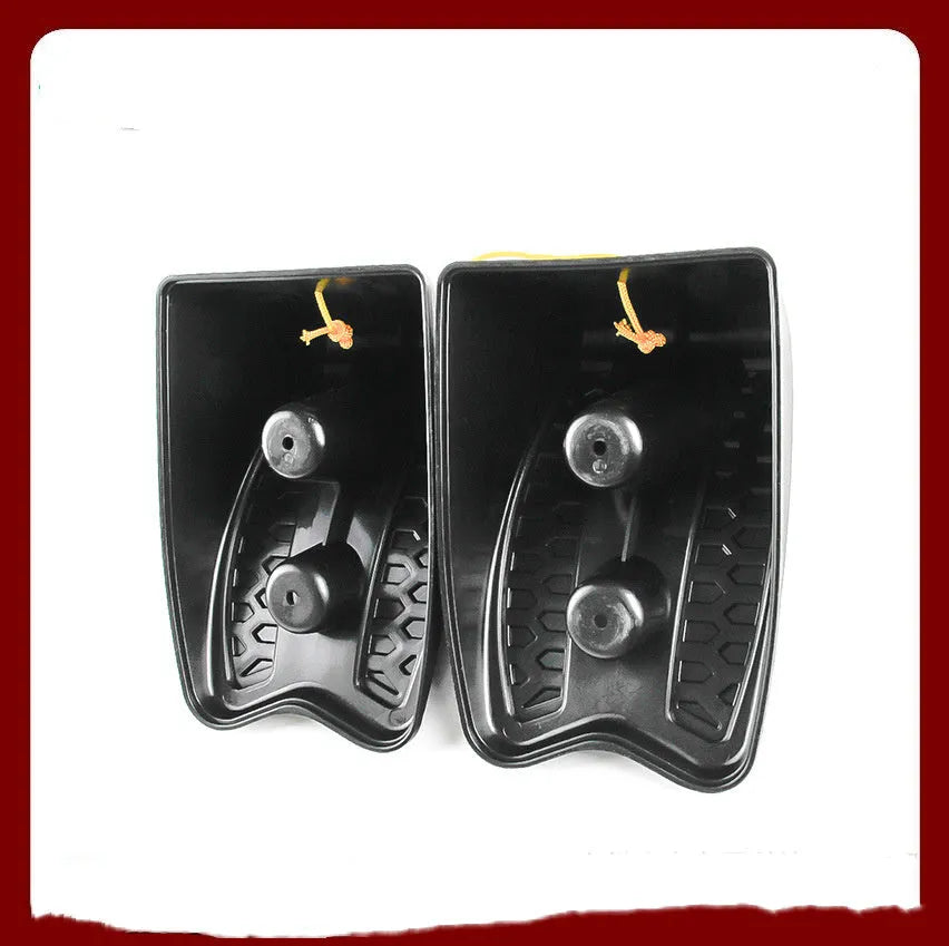 Pair of black wedge-shaped rubber car wheel stoppers with arc bevel and anti-slip base