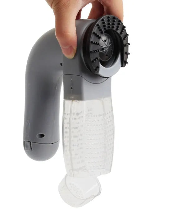 Grey handheld electric pet hair remover vacuum brush with soft rubber head.