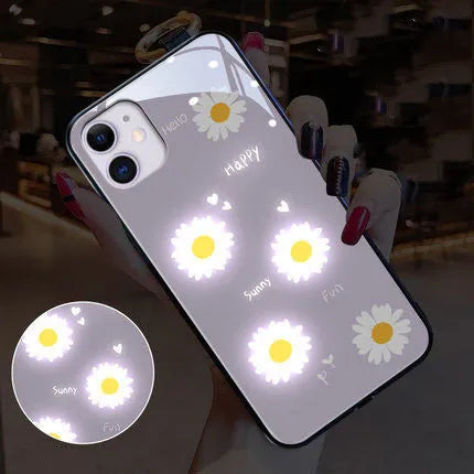 Luminous daisy design iPhone case with voice-activated colour light on an Apple iPhone