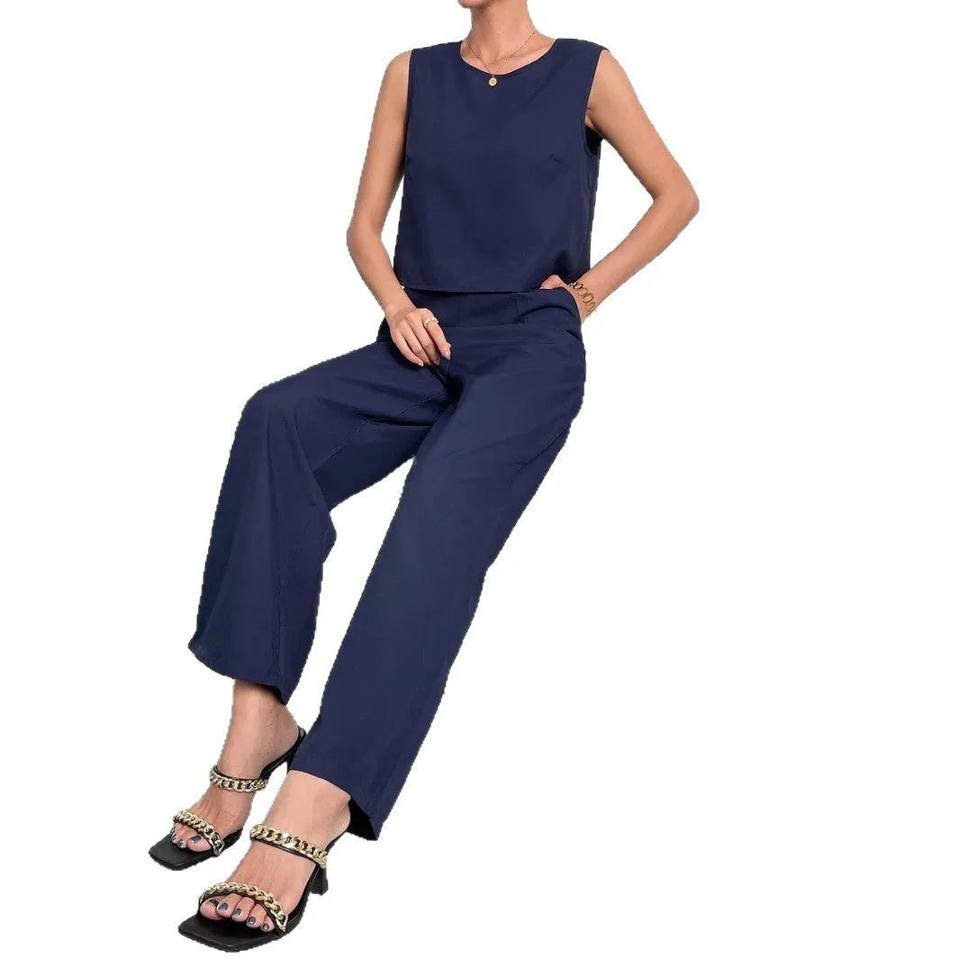 Red women's two-piece set featuring a sleeveless round-neck top and matching wide-leg trousers on a hanger.