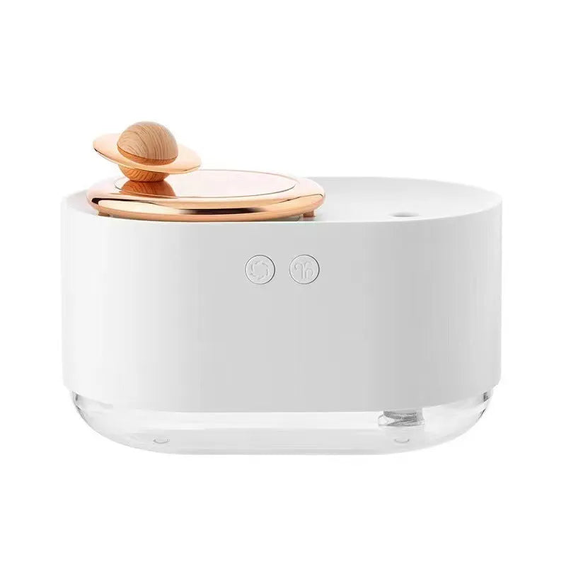 Green rotating planet-shaped USB humidifier with night light on a wooden desk