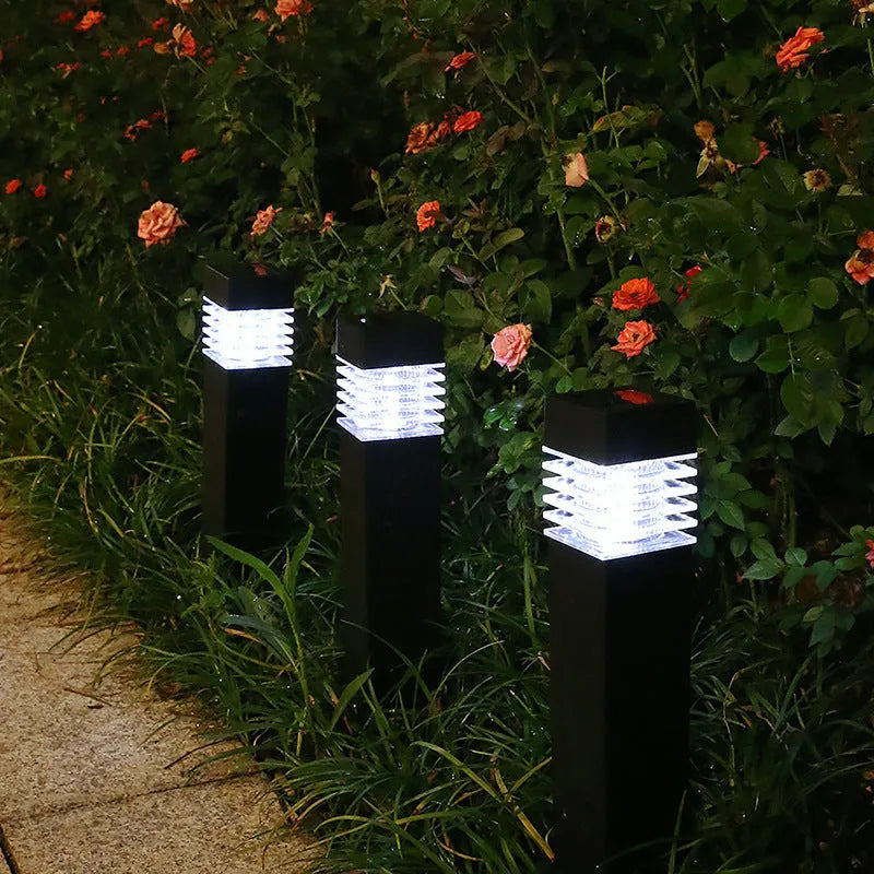 White cuboid solar lawn ground lamp for outdoor garden lighting.