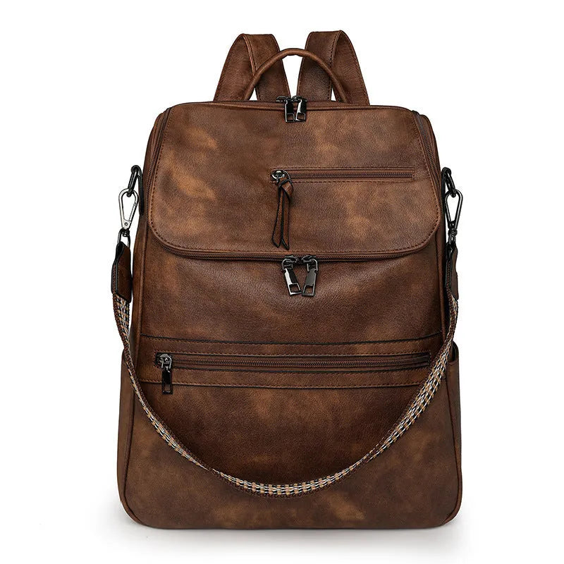 Retro college style PU backpack with curved shoulder straps shown in a solid colour with stitching detail.