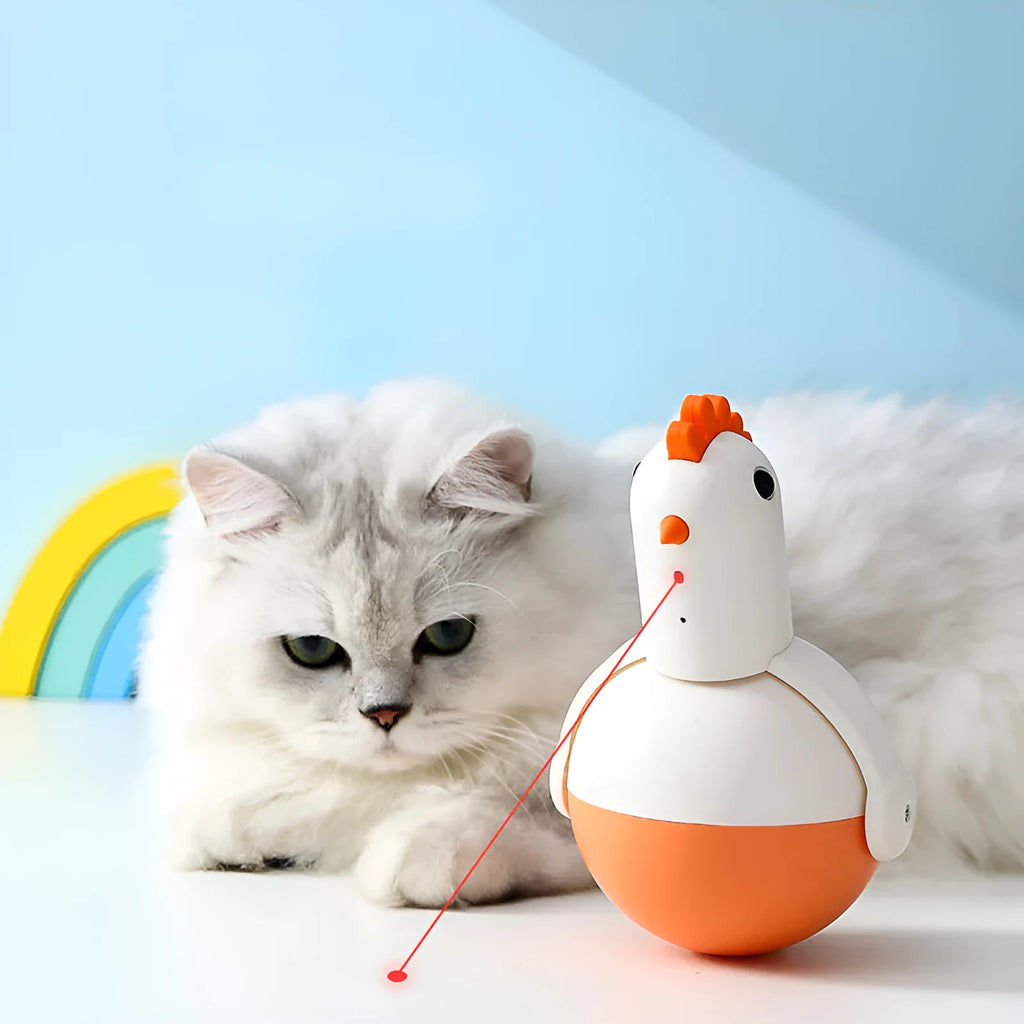 Green electric cat toy chicken with laser light feature on flat surface