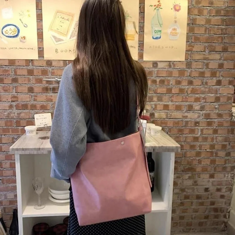 Pink corduroy one-shoulder bag with a single strap, shown with dimensions.