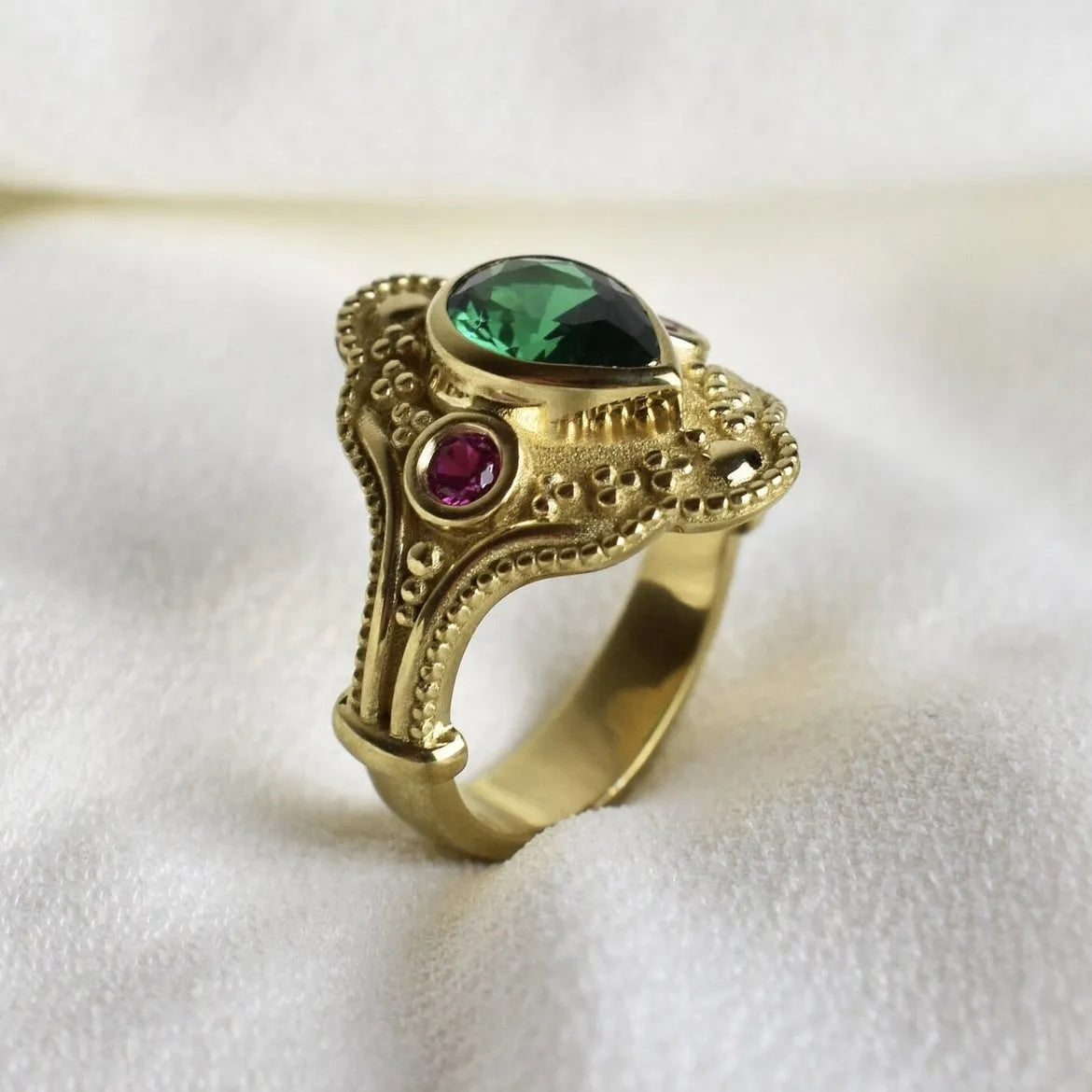 Gold geometric women's ring on display showing alloy construction with electroplated finish