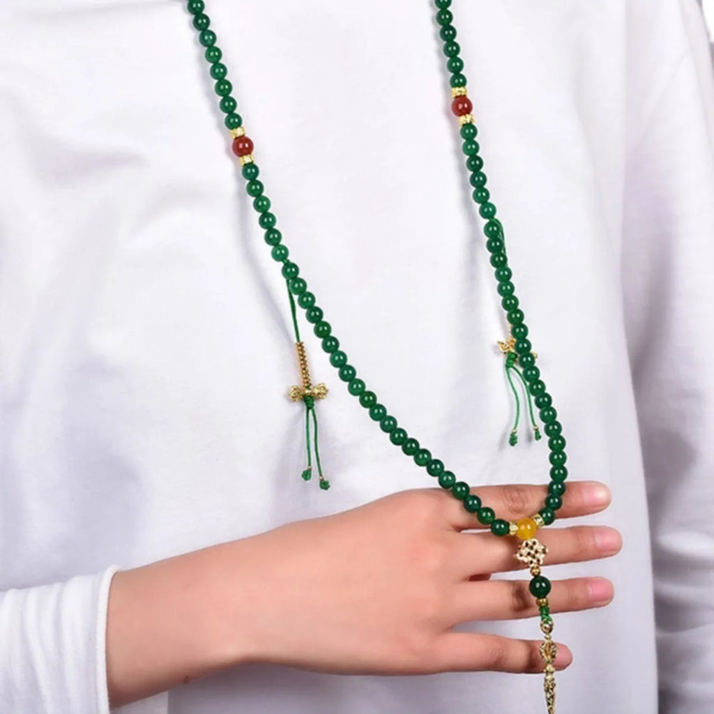 Handmade multi-strand green agate bracelet from Brazil on a wrist, showing stone sizes 6mm, 8mm, and 10mm.