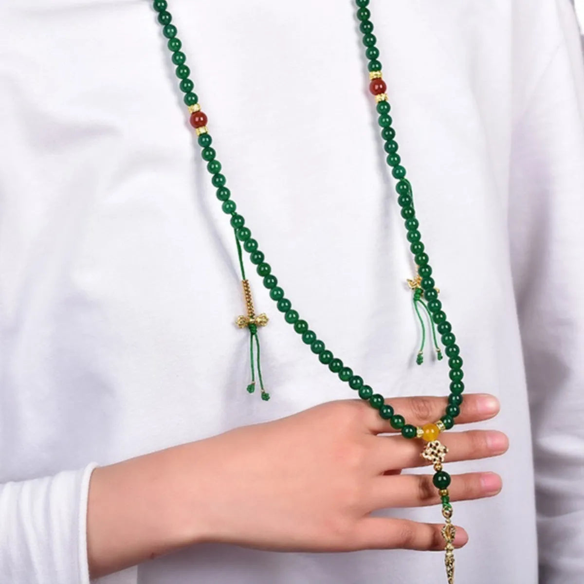 Handmade multi-strand green agate bracelet from Brazil on a wrist, showing stone sizes 6mm, 8mm, and 10mm.
