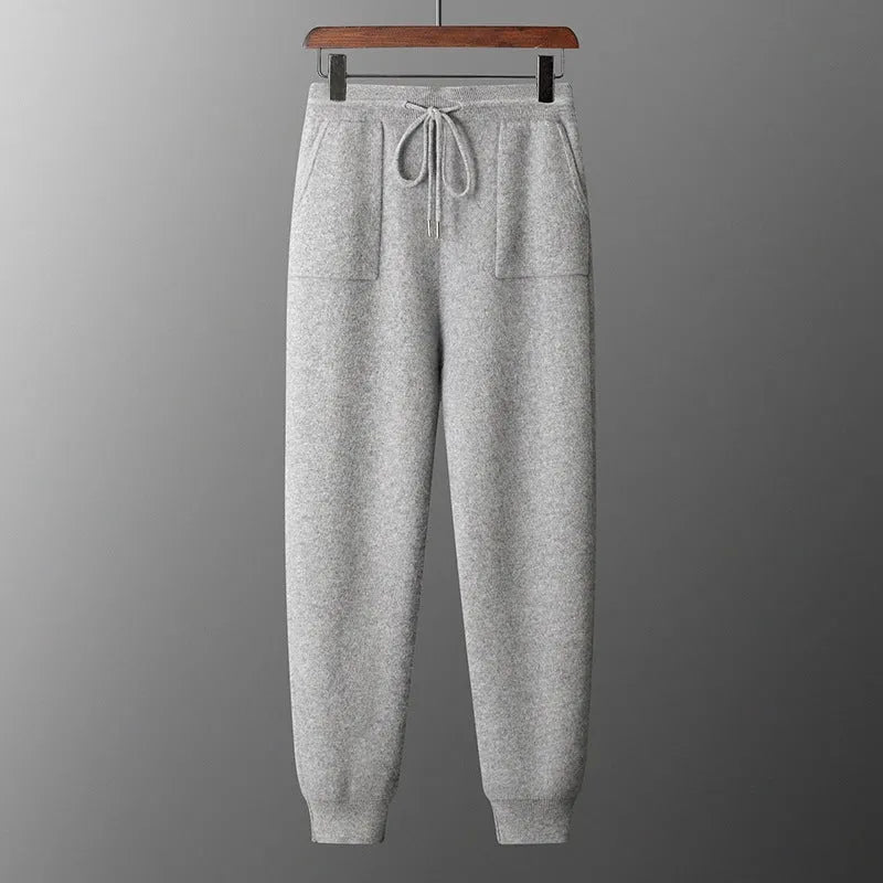 Men's light gray cashmere hooded sweatshirt and long pants set on a hanger.