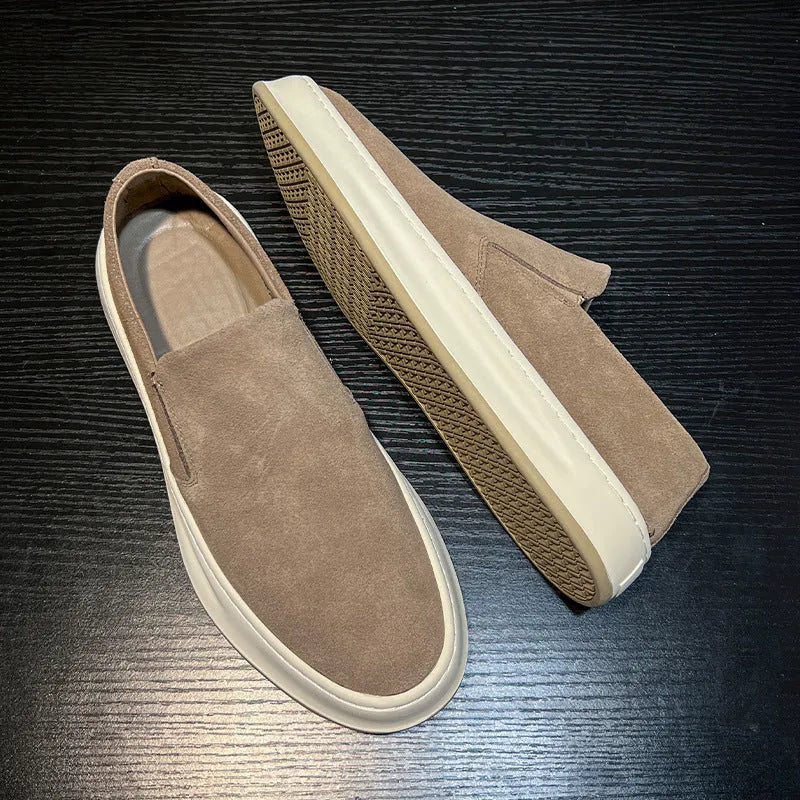 Men's casual slip-on shoes in apricot colour with round toe and mid heel, showing sewing line detail on artificial PU upper