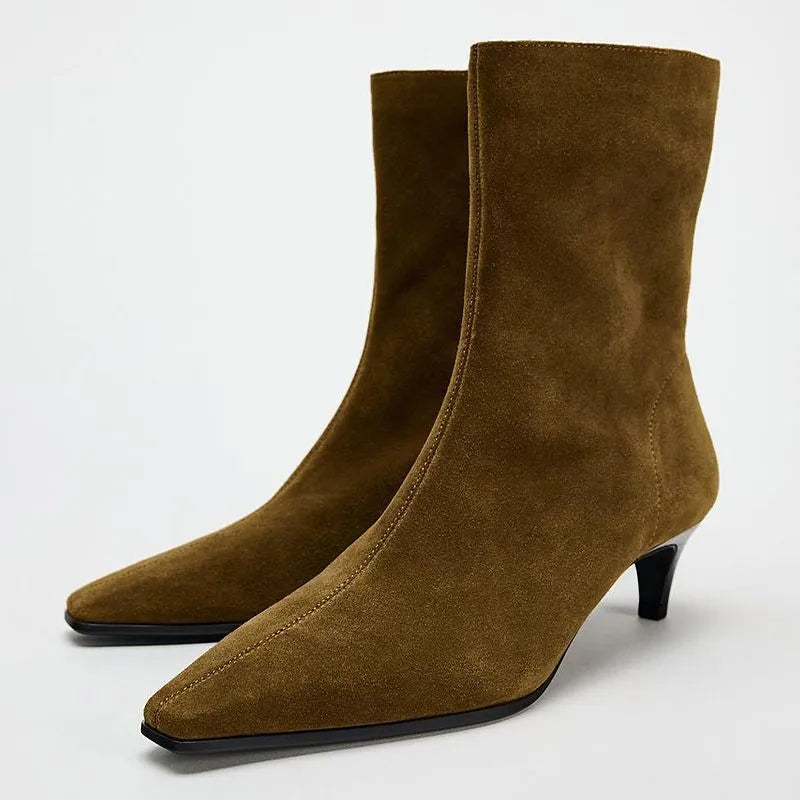 Brown women's square toe ankle boots with a side zipper and a kitten heel on a waterproof platform sole.